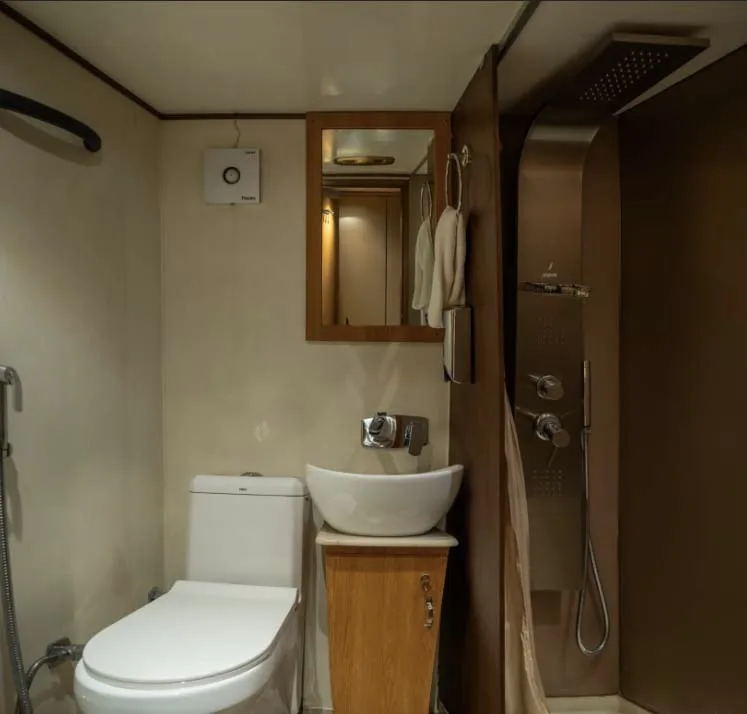 Washroom inside the 4 seater caravan — western WC and wash basin