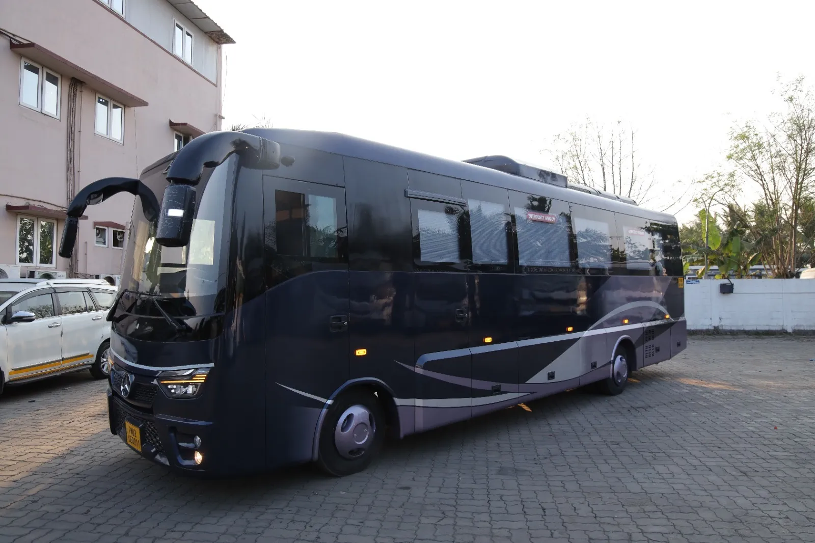 6 seater luxury caravan rental in Chennai — exterior front three-quarter view