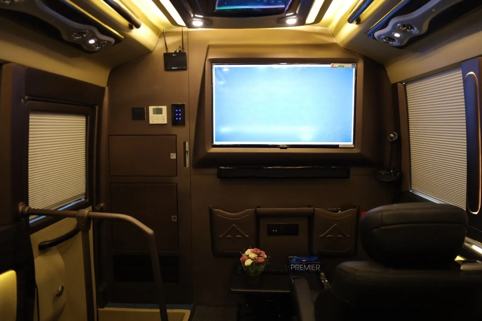 Inside the 6 seater luxury caravan in Chennai — lounge with TV and ambient lighting